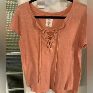 Billabong woman’s lace up front tee shirt peach size medium